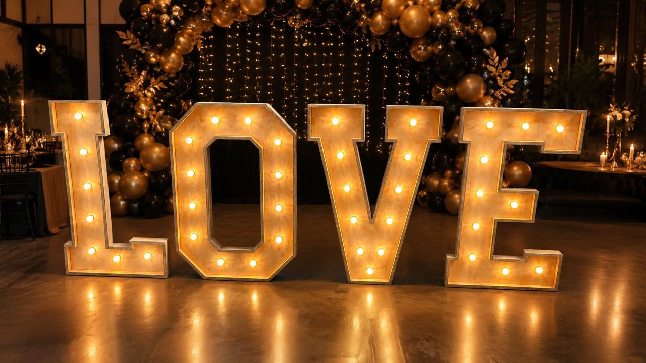 The finished LOVE letters lit up by the client
